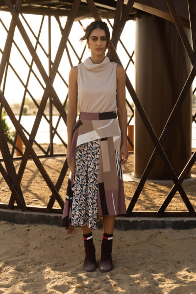 Constructive skirt with contrast pleated layer