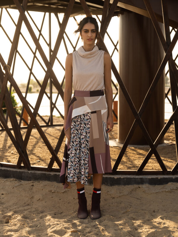 Constructive skirt with contrast pleated layer